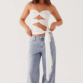 Women's edgy black strapless cutout crop top.